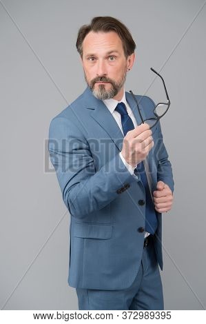 Serious Businessman. Education For Adults. Perplexedly Removes Glasses. Business Education. Self Edu