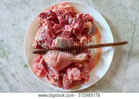 Uncooked Chicken & Mutton Side-by-side View, After Mixing Some Ingredients & Processing, It Becomes 