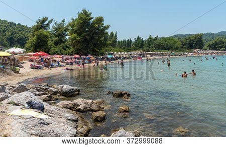Chalkidiki, Greece, July 25 2017: People Swimming And Enjoying Summer Vacations. Paliouri Beach, Kha