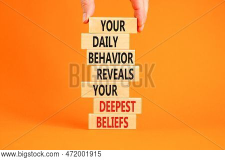 Behavior Symbol. Concept Words Your Daily Behavior Reveals Your Deepest Beliefs On Wooden Blocks. Be