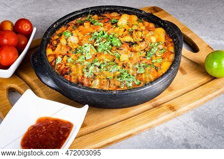 Charru Mussel, Known In Brazil As Sururu Moqueca, On Wooden Board. Beside Pepper, Lemon And Small To