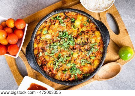 Charru Mussel, Known In Brazil As Sururu Moqueca, On Wooden Board. Beside Pepper, Lemon, Small Tomat