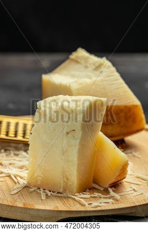 Gruyere Hard Yellow Cheese. A Traditional Swiss Hard Yellow Cheese Without Holes, With A Dark Crust 