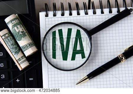 Letters Iva (inventory Valuation Adjustment) Under A Magnifying Glass On A White Notebook Against Th