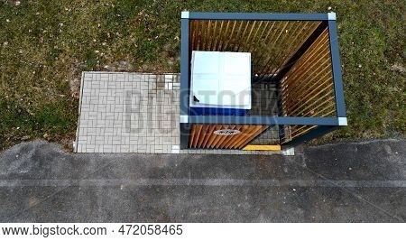 Closing Cage For Placing Chemical Toilets. Unsightly Plastic Boxes Are Inside Metal House With Flat 
