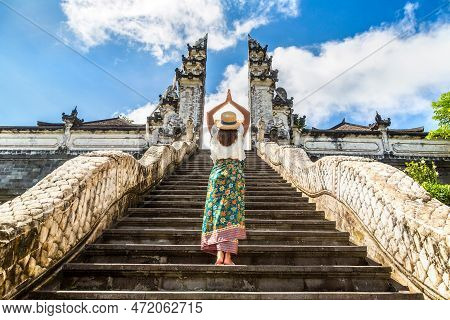 Woman Traveler At Ancient Gate At Pura Penataran Agung Lempuyang Temple On Bali, Indonesia
