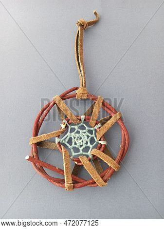 First Nations Dreamcatcher With Sinew And Leather Isolated On A White Background