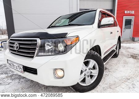Novosibirsk, Russia - 04.03.2023: Front View Of Toyota Land Cruiser 200 J200 2013 Year White Color A
