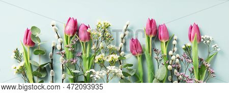 Beautiful Composition Spring Flowers. Bouquet Of Pink Tulips Flowers, Eucalyptus, Spring Willow On P