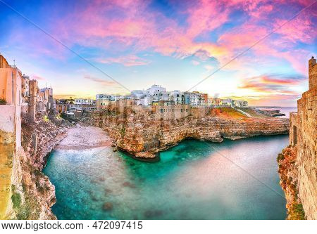 Stunning Sunset At Cala Paura Gulf With Bastione Di Santo Stefano And Lama Monachile Beach In Backgr