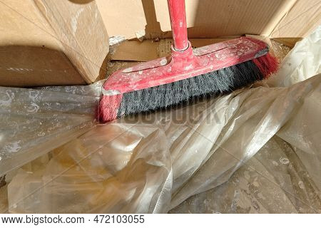 Wooden Floor Covered With Transparent Foil With White Paint Stains And Smudges In Preparation For Pa