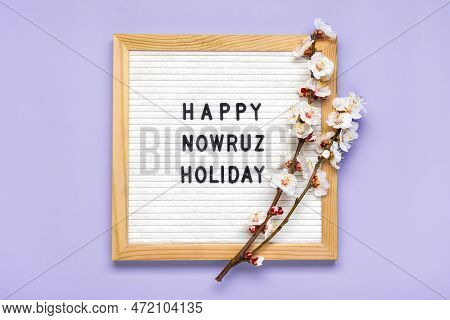 Sprigs Of The Apricot Tree With Flowers On Lilac Background Text Happy Nowruz Holiday Concept Of Spr