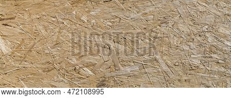 Chipboard Surface With Pressed And Glued Sawdust. Long Abstract Wooden Textured Background.