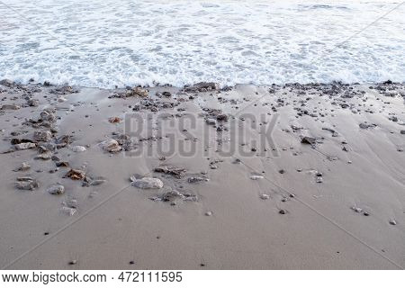 The Sea Wave Run On Sandy Beach With Small Stones, Top View. Soft Tidal For Publication, Design, Pos