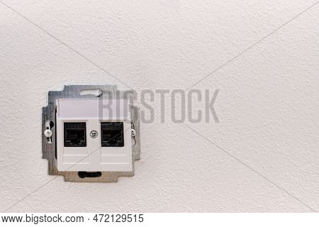 Installing or repairing on-wall internet network socket for a computer, CAT.5E, open during, black c