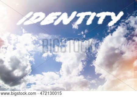 Identy. Text From Clouds In Sky In Bright Sunlight.