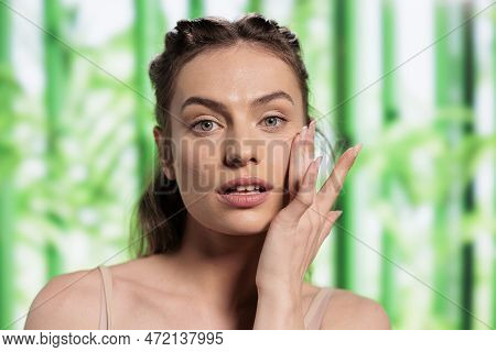 Young Beautiful Woman Touching Smooth Skin With Fingers And Doing Skincare Routine. Attractive Model