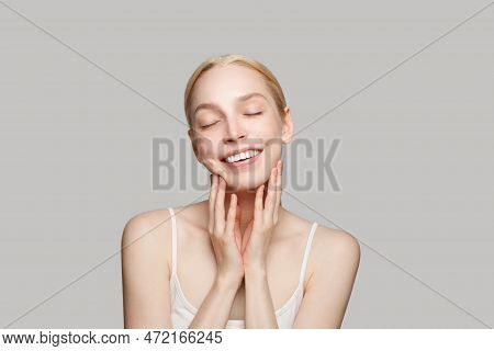 Portrait Of Beautiful Woman And Her Hands  Isolated On Grey Background. Beauty, Cosmetics, Skincare,