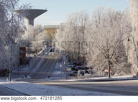 View Of Street Amidst Buildings In City During Winter