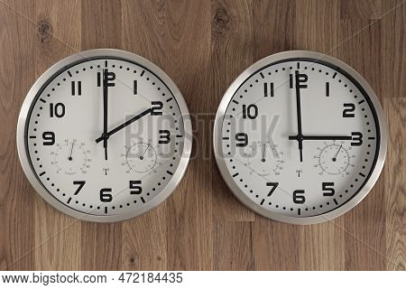 Two Clocks, One Showing Two O'clock, The Other Showing Three O'clock.  Time Change Symbol. Daylight 