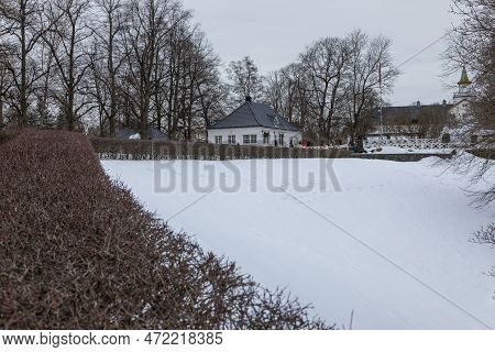 Norway, Oslo - 27 February 2019: White Building In Frogner Park Pond During Winter, Public Park In C