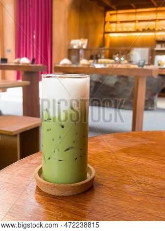 Iced Matcha Greentea On Wooden Table In Coffee Shop, Stock Photo