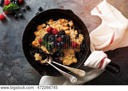 Berry Crumble In A Cast Iron Pan With Fresh Raspberry And Blueberry