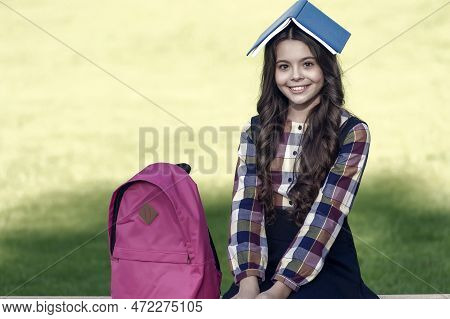 Feeding Your Brain With Reading. Happy Child Hold Book On Head. Reading Education. Book Learning. Sc