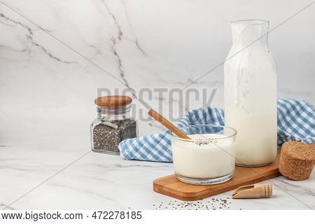 A Bottle Of Milk And Glass Of Yogurt, Kefir, Fermented Milk, Probiotic Cold Fermented Dairy Drink. T