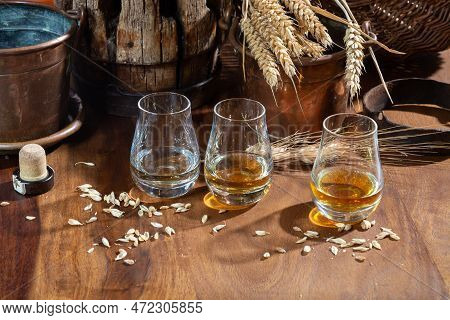 Speyside Scotch Whisky Tasting On Old Dark Wooden Vintage Table With Barley Grains Close Up