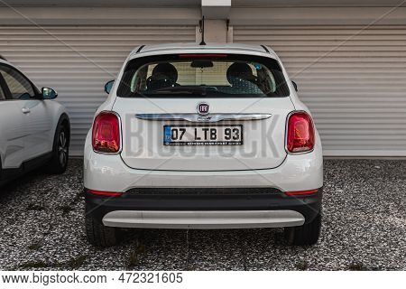 Side; Turkey - February 01 2023:   White Fiat 500x  Parked On The Street On A Warm Day Against The B