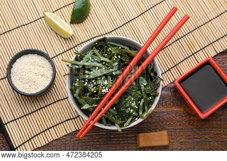 Fresh Laminaria (kelp) Seaweed Served On Wooden Table, Flat Lay