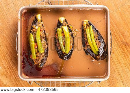 Top View Of Hot Delicious Turkey Stuffed Eggplants - Karniyarik In Golden Tray Metal Ovenware On Met