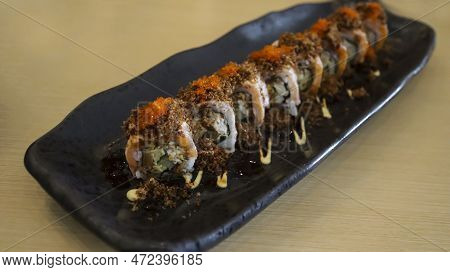 Aburi Salmon Roll Consist Of Crab Meat With Soft Shell Crab, Sushi Rice And Rolled Up. After That, T