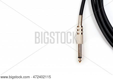 Long Black Jack Cord For Electric Guitar, Filmed On A White Background.