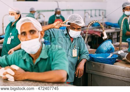 Ajman, Uae, United Arab Emirates - May 26, 2021: Men Cleaning Fresh Fish At Fish Market In Ajman. Aj