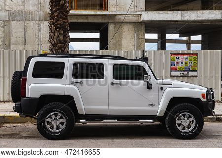 Side, Turkey - February  05, 2023:    White Hummer H3 Is Parked  On The Street On A Warm  Day