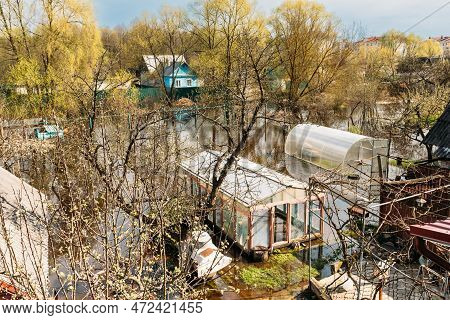 Vegetable Garden Beds In Water During Spring Flood Floodwaters During Natural Disaster. Greenhouse H