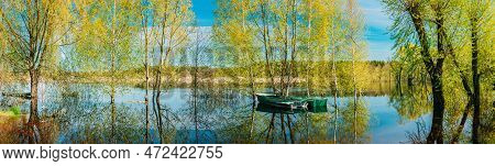 Panorama Old Boats Moored Near Trees That Standing In Water During Spring Flood Floodwaters. Reflect