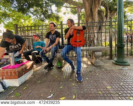 Buenos Aires, Argentina - 29 October 2022 : Musicians With Guitar Sitting On A Street Bench On The F