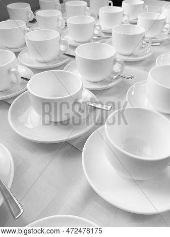 Many Rows Of White Ceramic Coffee Or Tea Cups. Lines Of Coffee Cups In Front Of Conference Room. Whi
