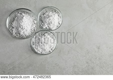 Petri Dishes With Calcium Carbonate Powder On Light Grey Table, Flat Lay. Space For Text