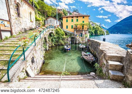 Town Of Nesso Waterfront And Idyllic Harbor  On Como Lake, Lombardy Region Of Italy