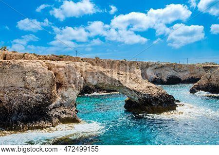 Love Bridge Near Ayia Napa In Cyprus, View From Water. Natural Rock Arch Formation Bridge Of Lovers 