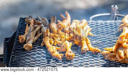 Grilled Chicken Feet On A Charcoal Grill In The Township Of Langa Near Cape Town