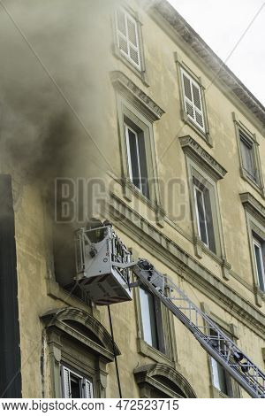 Editorial, Domestic Apartment Fire With Smoke Billowing From Window. Garibaldi Square, Naples, Italy