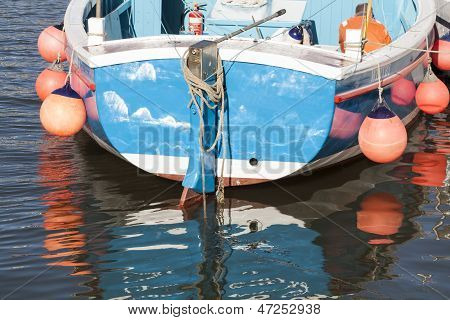 Floating Boat In The Bay