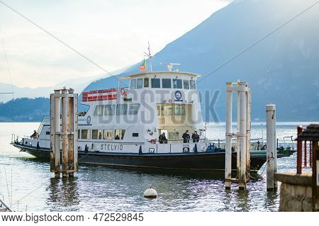Varenna, Italy - April 2022: Ferry Boat Docked In Marina Of Varenna, A Town On The Shore Of Lake Com