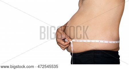 Closeup Of The Mid Section Of An Obese Man Holding A Measuring Tape Around His Waist