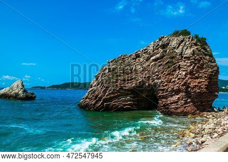 Beautiful Rocks On Pebble Public Stone Beach. Rafailovici Esort Towns. Mountenegro. Adriatic Sea.